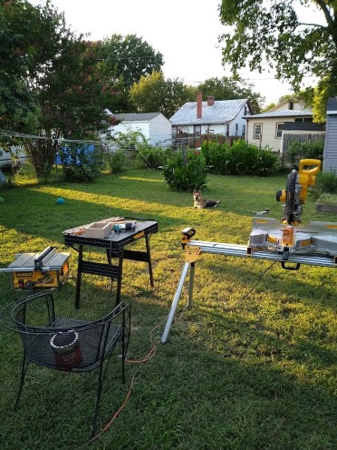 miter saw and table saw set up in backyard for carpentry